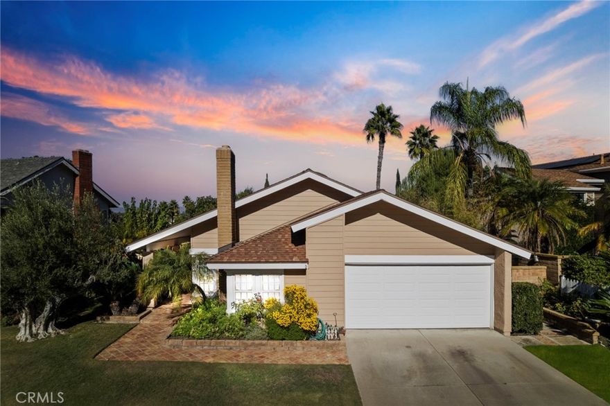 Welcome to this rare single-story home in the highly sought-after Laguna Hills neighborhood. Offering three bedrooms, two full baths, and 1,789 sq. ft of comfortable living space, this inviting property blends charm and functionality. Real hardwood flooring, abundant windows, and a cozy living room fireplace create a bright and welcoming atmosphere throughout. The kitchen features classic Spanish-style tile, an impressive walk-in pantry, and cabinets with deep 18-inch pull out drawers for exceptional storage. The updated primary bathroom includes a spacious walk-in shower and access to a walkable attic with generous storage. Additional highlights include an interior separate laundry room, a tankless water heater, whole home water filtration system, and a 2 car garage  including walkable attic storage above, storage cabinets, and a workbench for your tools. The large, lush backyard offers the perfect setting for outdoor enjoyment and relaxation. Ideally located within walking distance to a local park and minutes from shopping, top-rated schools, the community center, and freeway access, this home combines comfort, convenience, and potential. It is Sold as-is,  and it's ready for the right buyer to add their personal upgrades and make it truly their own. Schedule your private showing today!