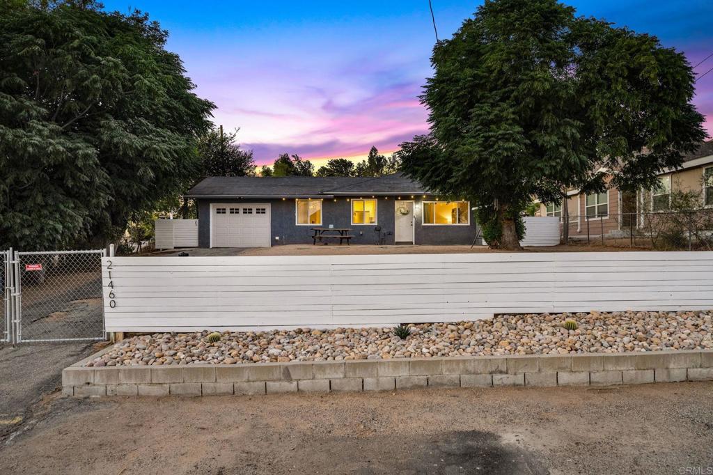 VA BUYERS have option to assume the Seller's very low 2.875% Interest Rate. This charming property sits on a large lot with mature fruit trees, offering shade, beauty, the perfect touch of country living and NO HOA! Featuring an open floor plan with a spacious living room & bedrooms providing comfort and flexibility for family and guests. The master bedroom includes a cozy fireplace and French doors that open to the outdoors, blending comfort with charm. With plenty of usable space, the possibilities are endless. Enjoy the peace of rural living while being just minutes from the 15 Freeway for easy commuting. Nearby parks, hiking trails, and Lake Elsinore offer abundant outdoor recreation, along with shopping, dining, and medical facilities close at hand. The perfect place to start your next chapter!