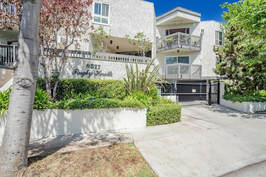 Prime West Hollywood Condo in a highly sought-after location! Nestled on a tranquil, tree-lined street, this secure and gated complex offers both privacy and convenience. The condo spans approximately 1,000 square feet, featuring 2 bedrooms and 2 bathrooms. Step onto your private balcony and enjoy peaceful tree-lined views. The living areas showcase stylish tiled floors, while the bedrooms offer warm laminate flooring. The condo features a beautifully remodeled kitchen with updated countertops and appliances, all seamlessly integrated into the open-concept family room. The spacious master suite boasts ample closet space. Additional highlights include 2 gated parking spaces and guest parking.  Just one block south of Santa Monica Blvd, this condo is within walking distance to markets, gyms, trendy restaurants, vibrant nightlife, coffee shops, and upscale shopping.