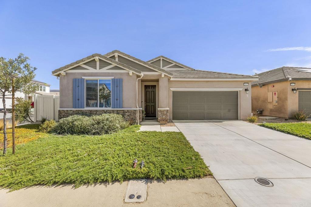 Welcome to Park Circle, Valley Center’s premier master-planned community, where small-town charm meets modern living. Step inside this single story, newer construction home with soaring 9-foot ceilings and an open floor plan that’s both spacious and inviting. The gourmet kitchen is a showstopper, featuring stainless steel appliances, granite custom countertops, an undermount sink, and abundant storage. Natural gas powers the oven, dryer, and water heater for efficiency, while owned solar adds significant energy savings. The home offers three bedrooms plus a generously sized office/bonus room with double doors that can easily serve as a fourth bedroom, providing flexibility for your lifestyle. Elegant upgrades include 8-inch ceramic tile flooring, recessed lighting, and a substantially constructed, covered patio that opens to a fully fenced backyard enhanced with additional hardscape and pavers—perfect for privacy, relaxing and/or entertaining. The current VA mortgage on this home is also assumable at a 4.875% interest rate for qualified buyers. Beyond the home, Park Circle’s resort-style amenities make every day feel like a getaway. Residents enjoy multiple pools, a fitness center, clubhouse, playgrounds, dog parks, sports courts, and over 6 miles of scenic walking trails. The vibrant community hosts regular events, creating a welcoming neighborhood atmosphere. This is more than a home—it’s a lifestyle of comfort, convenience, and connection in one of Valley Center’s most desirable neighborhoods.