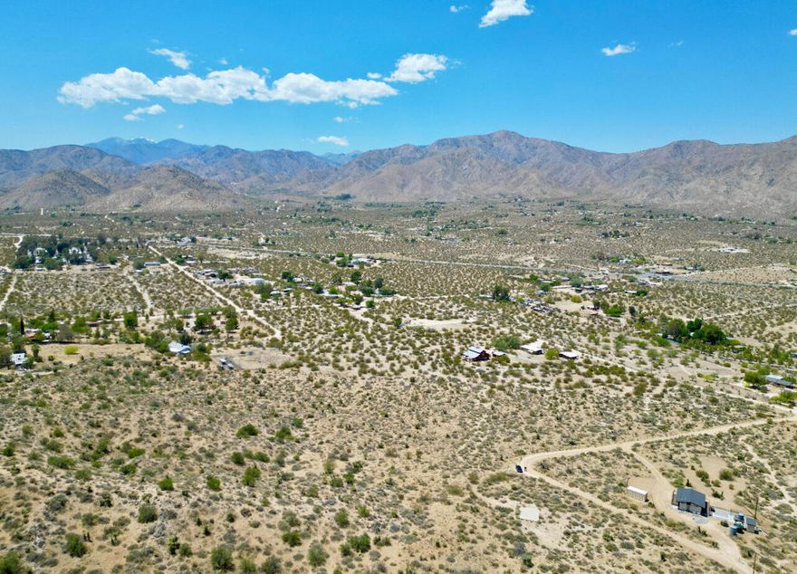 Views! views! Views! This 5-acre lot offers breathtaking views of Morongo Valley mountains, stunning sunrises, and star-filled night skies. Just minutes from Highway 62, Joshua Tree, and Palm Springs, it's perfect for a dream home, private retreat, or off-the-grid escape. Don't miss out--contact us today!