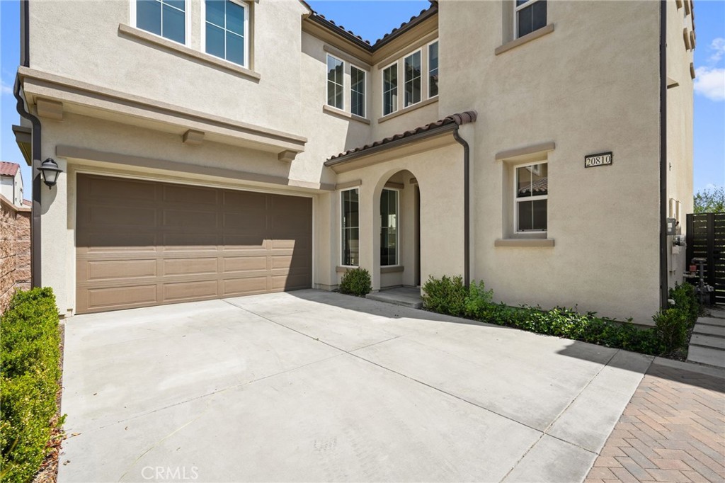 Step into this light-filled, stylish home tucked away in the guard-gated Canyons community with resort-style amenities, including a sparkling pool. The open floor plan is perfect for modern living, featuring a convenient main-floor bedroom, ideal for guests or a home office, and 3 additional bedrooms upstairs, including a large loft and spacious master suite with a walk-in closet.
The heart of the home is its gourmet kitchen, complete with high-end KitchenAid appliances, ceiling-height cabinetry, and a generous island for casual dining or entertaining. Just minutes away, you’ll find the Porter Ranch Vineyards shopping center with Whole Foods, Peet’s Coffee, and many dining options! You're walking distance from the brand new Porter Ranch Community Park — making this a perfect blend of style, comfort, and community. Located in the prestigious Porter Ranch Community School boundaries.