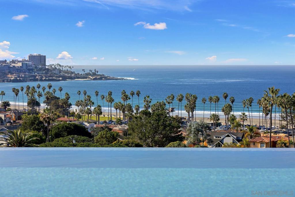 Dynamic Shores contemporary residence with the best views imaginable. Brand new and years in the making, it offers high style, a gorgeous aesthetic, an energizing vitality. Beautifully sited on a prime lot, just blocks to the surf and sand, this marvelous home is extraordinary in its design, affording it comfortable living in an open/airy environment. The ever-changing view panorama is exquisite, from sunrise to sunset, day in and day out. Be the first to live in this almost-completed home with a space for every need. Plenty spacious, it offers 7 en-suite bedrooms, 8 full and 2 half baths, a theater, gym, office/den, refrigerated wine room, 8-plus-car garage, and elevator. Open in concept, the living areas are extremely inviting with easy flow to massive decking and the infinity-pool. The home reflects an abundance of good taste; exquisite finishes/materials; a soothing color palette.... Gorgeous! Equipment: Garage Door Opener Other Fees: 0 Sewer: Sewer Connected