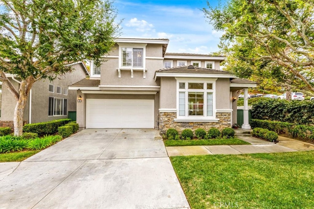 Welcome to this stunning 4-bedroom, 2.5-bathroom home in the desirable Harvest community of Aliso Viejo, where homes rarely come on the market. Perfectly situated on a corner lot at the end of a quiet cul-de-sac, this nearly 1,900 sq. ft. residence blends comfort, style, and functionality in every detail. From the moment you enter, you’re greeted by soaring ceilings, abundant windows, and natural light, creating an inviting and airy atmosphere. Plantation shutters add timeless elegance while maintaining privacy. The open-concept main level is designed for modern living, featuring brand-new laminate flooring throughout and a remodeled kitchen with recessed lighting, quartz countertops, shaker cabinetry, a Viking 6-burner gas range, and Bosch stainless steel refrigerator and microwave—ideal for both everyday meals and entertaining guests. The peaceful backyard, accessible directly from the kitchen, feels like a true extension of the living space. Complete with a built-in grill and plenty of room for gatherings, it’s the perfect spot for summer barbecues, weekend entertaining, or simply relaxing outdoors. Upstairs, you’ll find all four bedrooms along with a conveniently located laundry room. The secondary bathroom is generously sized, offering dual sinks, crown molding, tile floors, and a shower/tub combination. The primary suite is a luxurious retreat with a mirrored closet door, a large walk-in closet, and a spa-inspired bathroom showcasing dual sinks with granite counters, a soaking tub, a step-in glass shower, crown molding, and custom lighting. The Harvest community is known for its pride of ownership and peaceful setting. Enjoy being within walking distance to neighborhood parks, hiking, and biking trails, and just a short drive to shopping, dining, entertainment, and convenient freeway and toll road access. Families will especially appreciate the home’s location within the award-winning Aliso Viejo school district. Don’t miss this rare opportunity to own in Harvest—schedule your private showing today!