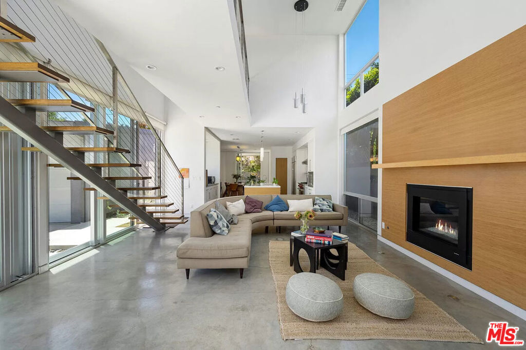This newer contemporary home blends modern design with an unbeatable West Hollywood West location. Over 2,500 sq ft of light-filled living space features polished concrete floors, warm bamboo upstairs, and seamless indoor-outdoor flow through expansive sliding glass doors.The chef's kitchen boasts Wolf, Sub-Zero, and Bosch appliances, sleek countertops, and custom cabinetryperfect for entertaining. Upstairs, each bedroom includes a walk-in closet, while the primary suite offers a spa-like bath for ultimate relaxation.Outside, the private yard is a blank canvas for a lounge area or fire pit. Situated on a large 6000sf lot with room for entertaining and a two-car garage. Just steps from WeHo's top dining, shopping, and nightlife, this home is modern elegance in the heart of the city.