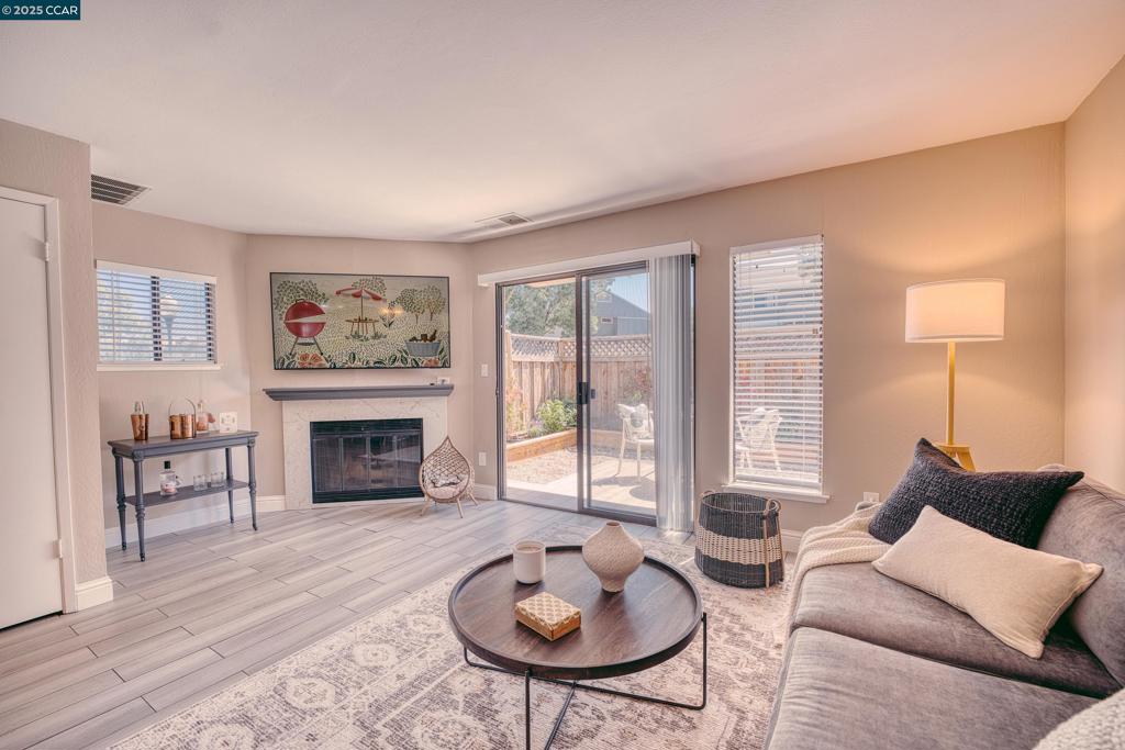 Welcome to this charming condo at 1821 Paseo Laguna Seco! Beautifully remodeled, it features dual-pane windows for ample natural light. The entry reveals a convenient half bath and a remodeled kitchen with stainless steel appliances and granite countertops, open to the dining area. The cozy living area includes a fireplace and rear patio access, perfect for relaxation. Upstairs, find two bedrooms with private baths and ample closets, plus an in-unit washer and dryer situated in the hallway between the bedrooms. The home has central AC and heating. Two assigned parking spaces, one covered, are directly outside the front door. Residents enjoy an inviting communal pool and proximity to Livermore Downs Park, which has added pickleball courts to the existing playground, basketball court, and spacious sports field. Conveniently located near downtown Livermore shopping and dining, wineries, Las Positas College, and LLNL, with easy access to the ACE train, freeway 580 east bound and west bound towards 680, highway 84 towards Sunol, and the Dublin BART station.