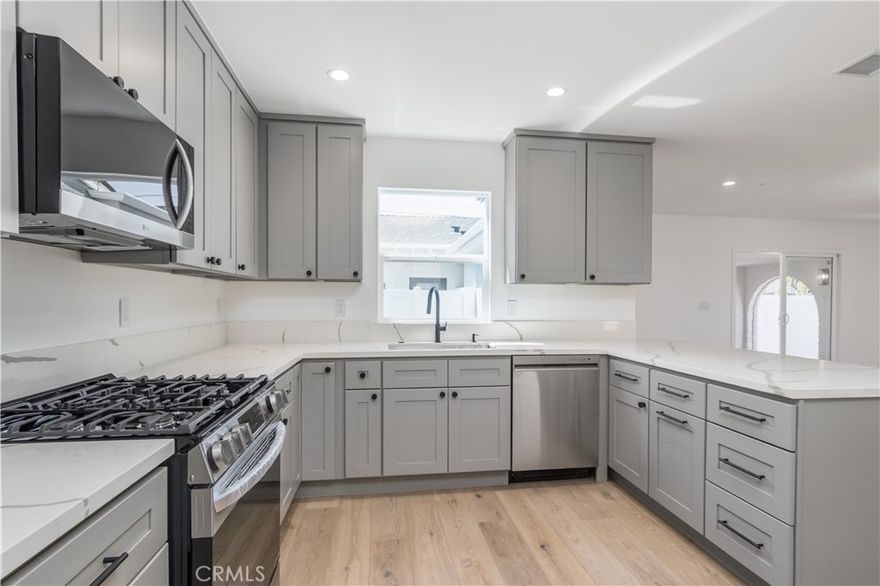 Main house of multi-unit property features open floor plan, remodeled 3-bed/2-bath home with large kitchen, huge living room, dining room, master on-suite bedroom with walk in closet and beautiful bathroom.  Large covered patio with big backyard space, turf and gas hookup for BBQ.   Large laundry room with good storage space.