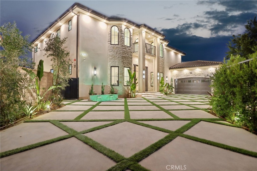The Crown Jewel of Porter Ranch!!! Introducing one of the most extraordinary residences ever crafted in the prestigious Northridge View Estates of Porter Ranch. This brand-new estate is the epitome of modern design and timeless sophistication, offering over 4,300 square feet of curated living space with 4 bedrooms, 4.5 bathrooms, and breathtaking views from nearly every room. Beyond the double private gates, you are greeted by a dramatic entrance. Custom iron doors open to a grand foyer with soaring ceilings and a floating staircase that feels straight out of an architectural magazine. The open-concept design is enhanced by walls of glass, flooding the home with natural light and framing uninterrupted city and mountain panoramas. The great room blends elegance with comfort, highlighted by a sleek fireplace and designer built-ins. Adjacent, the formal dining area features a glass-encased wine cellar that sets the stage for unforgettable gatherings. At the heart of the home is a chef’s dream kitchen with a dramatic oversized waterfall island, top-of-the-line built-in appliances, and bespoke cabinetry. A fully concealed secondary kitchen ensures effortless entertaining while keeping the main space pristine. Upstairs, the primary suite is a retreat beyond compare. A boutique-style walk-in closet with custom island cabinetry and a spa-worthy bathroom featuring dual vanities, a freestanding soaking tub, and a grand walk-in rain shower create the ultimate sanctuary. Step onto the private terrace and savor sunset views that stretch endlessly across the valley and mountains. The resort-inspired backyard defines California living with a sparkling pool and spa, custom outdoor BBQ, and sweeping panoramic views—an unmatched backdrop for entertaining or relaxing in complete privacy. Every detail has been perfected—from the smart home system and surround sound to dual-zone climate control and designer LED lighting throughout. Ideally located minutes from The Vineyards at Porter Ranch, the new community park, and award-winning schools including Granada Hills Charter High, this home also offers access to private tennis courts and a basketball court. Set on a cul-de-sac in a picture-perfect neighborhood, this residence is truly one-of-a-kind. Photos cannot capture its full magnificence—this home has set a new standard for luxury living in Porter Ranch.