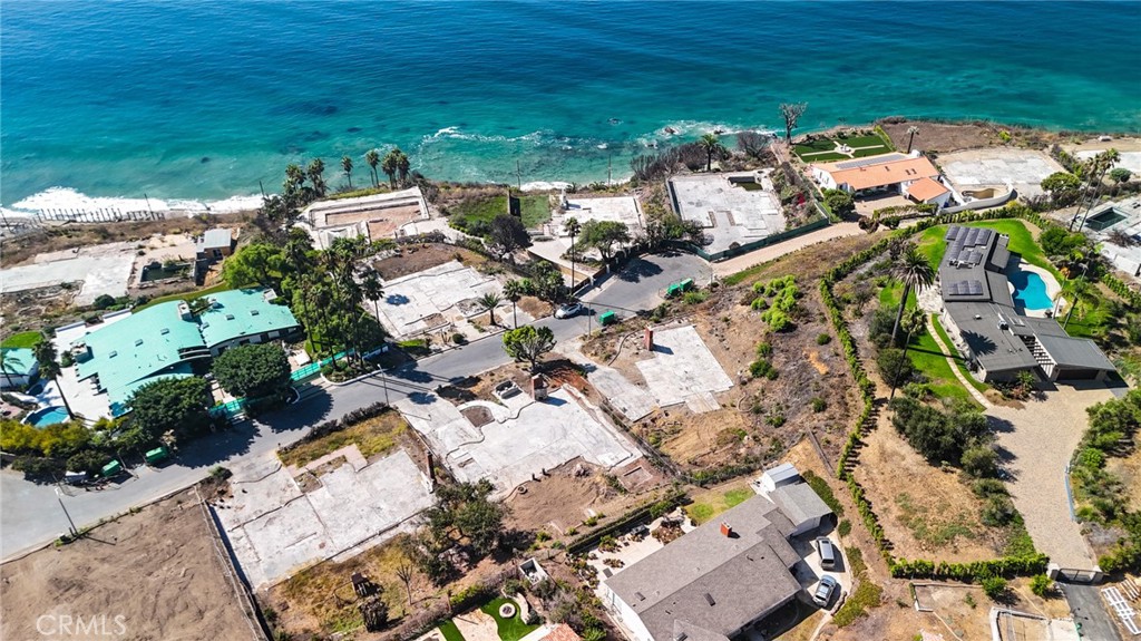 This exceptional .33-acre flat lot is tucked away on a quiet cul-de-sac in the highly sought-after lower Big Rock neighborhood of Malibu. The property showcases sweeping, unobstructed ocean views that span the coastline, Santa Monica Bay, and Catalina Island, all set against a dramatic mountain backdrop. A rare opportunity to build your dream home with commanding views in one of Malibu’s most desirable settings.