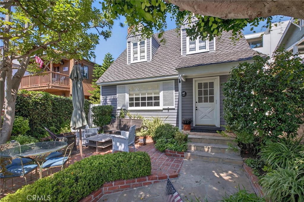 Welcome to this charming Manhattan Beach Sand Section retreat, just four blocks from the beach and surf. With timeless curb appeal and a classic Dutch door entry, this home exudes warmth and character from the moment you arrive. Inside, hardwood floors flow throughout spacious living areas, highlighted by three inviting fireplaces that create a perfect ambiance for coastal living. The light-filled kitchen is generously sized, ideal for both everyday meals and entertaining. The home offers 3 bedrooms and 3 bathrooms, including a stunning primary suite with dual walk-in closets—a rare and luxurious touch. Two car garage has washer/dryer, storage, plus parking in driveway. Freshly painted throughout, everything is included from the furniture to the forks. This home feels crisp, bright, and move-in ready.
Enjoy the outdoors in privacy with both a welcoming front yard and a brick back patio, perfect for dining al fresco or relaxing after a day at the beach. This Sand Section gem combines charm, comfort, and an unbeatable location—all just blocks from the ocean, a short drive to LAX, and steps to North End shops and restaurants.