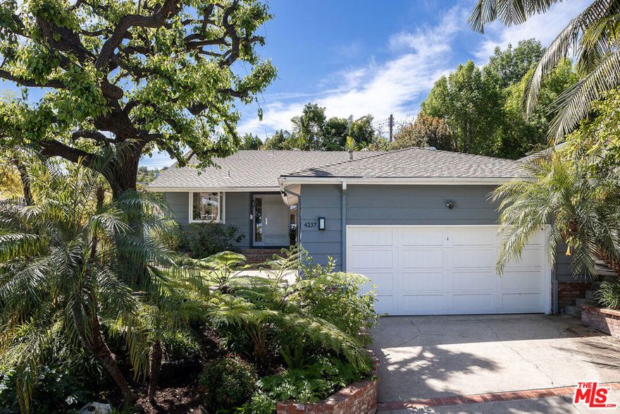 Welcome to your dream home tucked away in a serene and hidden cul-de-sac south of Ventura Blvd in the heart of prime Sherman Oaks! This stunning property offers an inviting and open living and dining area accentuated by soaring high ceilings and abundant natural light that streams through expansive windows and skylights. Step into the eat-in kitchen, which boasts ample pantry and counter space and stainless appliances, ensuring convenience and functionality. With three generously sized bedrooms and two bathrooms, this spacious home provides the best in southern California indoor/outdoor living. The primary bedroom, with its own en suite bathroom and excellent closet space, offers a peaceful retreat for rest and relaxation. Outside, escape to the lush backyard oasis, where tranquility and privacy abound. Lounge by the sparkling swimmer's pool on warm summer days or host gatherings with loved ones in this serene outdoor setting. Surrounded by verdant greenery, the backyard offers a secluded haven, perfect for relaxation and entertainment. And, if you're all about location, you can't get much better than this! This home is ideally situated near several freeways and only blocks from local favorites such as Blu Jam Cafe, Anajak Thai, Marmalade Cafe, Whole Foods, and a celebrated elementary school.