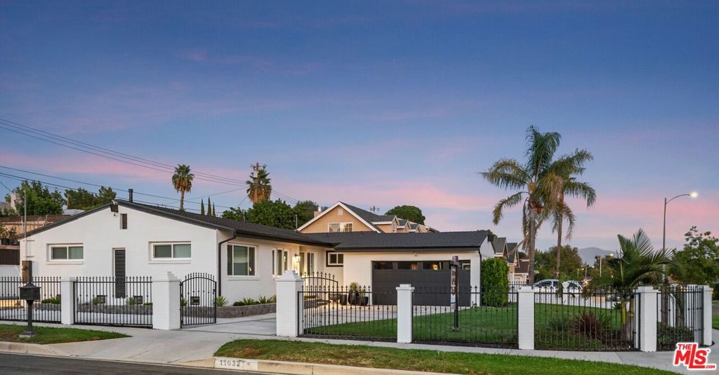 FALL in love with the stylish, contemporary design, of this fully renovated, four-bedroom, two-bath, move-in ready, pool home on a spacious corner lot in this coveted, north of Rinaldi, Granada Hills neighborhood! Ready for cozy nights by the fireplace or hosting seasonal parties, your decor will stand out beautifully against the laminate hardwood-look floors and quartz countertops. Matching Samsung appliances including a washer and dryer are included. The high post-and-beam vaulted ceilings feature recessed lighting and your living spaces get lots of light via dual-paned windows with custom blinds. When spring and summer come back around, you'll enjoy sunny days by the pool in a peaceful, private, and spacious backyard with room for outdoor dining, BBQs, and relaxation. Your front yard offers space to play and relax with a secure, gated lawn area, driveway parking for three vehicles, plus an additional paved pad for an RV or Boat, and a two-car garage with ADU potential for an in-law or income space. Exiting your driveway, you'll find yourself conveniently located near shopping including Target and Vons, schools, houses of worship, restaurants, great parks, golf courses, hiking, outdoor recreation, and easy access to major freeways. The current owners purchased the home in 2019 with newly renovated interiors throughout and then upgraded further with these NEW features: roof and gutters, HVAC, ductwork, water heater, nest thermostat, 13-camera Ring doorbell system, energy efficient pool equipment, garage door system, exterior paint, and mortar. It's the little things like soft drawer pulls, new hardware throughout, and ceiling fans in each bedroom that you'll appreciate as you continue to enjoy your new home for years to come. We invite you to experience the charm of this inviting home for yourself!