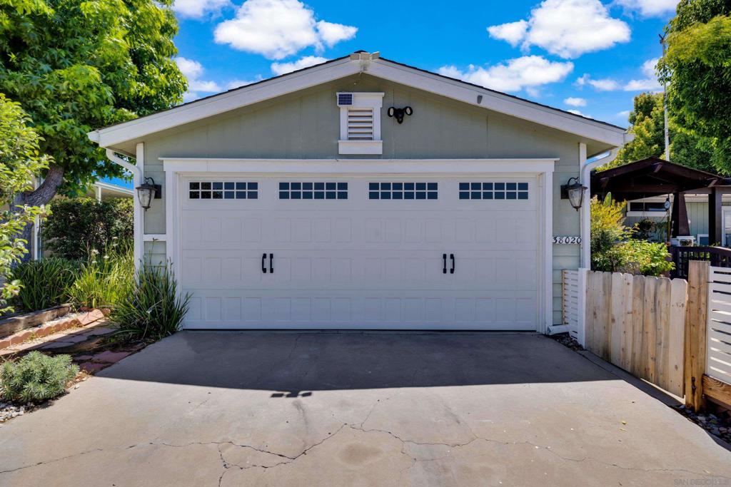 Welcome to Golf Knolls – 55+ Living in the Heart of Murrieta! This beautifully maintained Craftsman-style home offers comfort, style, and thoughtful accessibility in the highly desirable Golf Knolls 55+ community. Featuring a functional single-level floor plan, this home is handicap accessible and designed with both ease and elegance in mind. Inside, you'll find engineered hardwood flooring, a remodeled kitchen with stainless steel convection oven, cooktop with hood, tile backsplash, upgraded sink, soft-close drawers, and a pantry with pull-out shelves. A charming dining area includes French doors with side openings, perfect for enjoying evening breezes. The living room offers a cozy corner fireplace and large windows that let in natural light. The primary suite includes a spacious walk-in closet, ceiling fan, and an upgraded en-suite bath with dual sinks and built-in cabinetry. A large indoor laundry room with extra storage and a 2-car garage with direct access adds even more convenience. Step outside and enjoy your private yard with mature fruit trees—including pear, tangerine, lemon, and orange—offering beauty, shade, and a sweet harvest each season. Located close to shopping, dining, and the Golf Knolls clubhouse with pool and spa access, this home offers the perfect blend of peaceful senior living and modern convenience. Don’t miss your chance to own this lovingly upgraded home in one of Murrieta’s most welcoming 55+ communities!