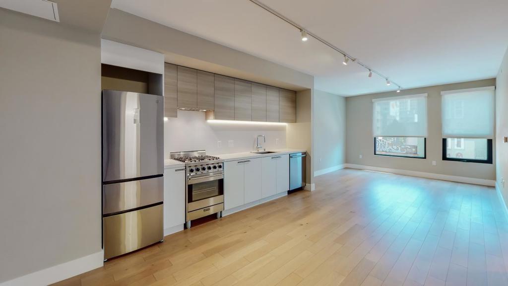 $200,000 Price Reduction from Its Original Purchase Price!! Welcome to 719 Larkin St. #301, a stylish and contemporary 1-bedroom, 1-bath condo in the heart of San Francisco. Built in 2019 by J.S. Sullivan, this boutique midrise offers modern city living with thoughtful design and premium finishes. Floor-to-ceiling windows flood the space with natural light, showcasing vibrant city views, while the open-concept layout creates a seamless flow between the kitchen, and living areas. The kitchen is equipped with sleek cabinetry, high-end appliances, and quartz countertops. The bedroom offers a tranquil retreat, and the spa-like bathroom features elegant finishes and a deep soaking tub. Step outside to the communal rooftop deck, where you can grill, lounge, and soak in the energy of the city from above. This home is ideal for young professionals, first-time buyers, or investors looking for a prime San Francisco property at an unbeatable value!