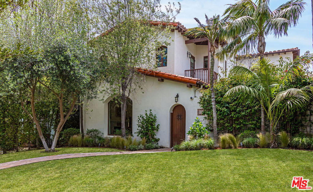 Spanish traditional with a modern and open living floor plan, this 5bed/4.5bath home is nestled just a short distance off Montana Ave. in one of the most highly sought after neighborhoods of Santa Monica. Boasting 4,244 sq. ft. of living space on a generous 8,023 sq. ft. lot, the warmth of this timeless California Spanish aesthetic exudes the epitome of coastal living. Enter through the private and intimate courtyard with a fireplace and ample space for gatherings, leading into a double height foyer and sitting room with a large, oversized window drenching it with sunlight. The oak floors and arched corridors throughout seamlessly flow into the formal dining room, open kitchen and living area with sets of French doors opening to a covered patio perfect for lounging. The lush backyard is adorned with mature succulents, olive trees, rose bushes, high privacy hedges, outdoor dining area, and unattached two-car garage with built-in storage. Four spacious bedrooms and laundry/utility room on the home's upper level make this ideal for families. Large primary bedroom with two spacious closets and a bathroom with steam shower and a tub overlook the beautiful sunlit backyard. Designed with the highest attention to detail and personal, custom finishes - this tranquil residence is an oasis in the heart of the best that Santa Monica living has to offer.
