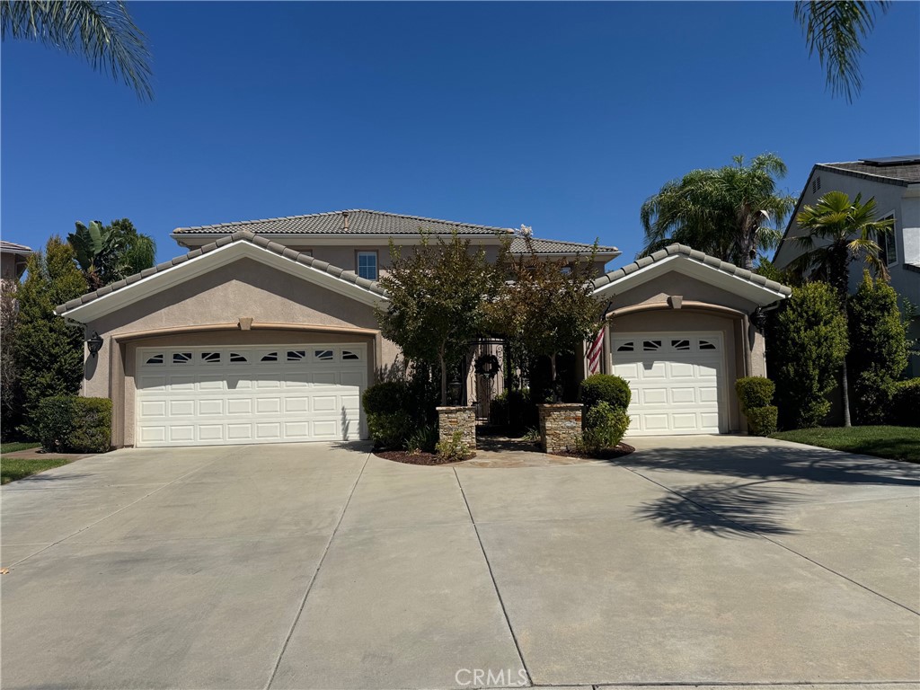 Welcome to the Gated Community of Vintage in Redhawk. This BEAUTIFULLY UPGRADED Home is a private oasis on a stunning cul-de-sac! The home showcases a unique floor plan and is ready for the perfect family! Come through the front gate and into the serene courtyard and enjoy the private sitting area between the single (perfect mancave) and double garages. Inside the stunning custom front door is a formal entry that opens to a grand living room. Crown molding is the perfect accent along with plantation shutters throughout. The family room features a surround sound system, stacked stone wall, media niche with shelves and a raised hearth with gas log fireplace. The remolded kitchen offers beautiful white cabinets with pull out cabinets, stainless steel appliances, granite slab counters, walk in pantry, and opens to the nook area and family room. One bedroom, with a walk-in closet and full bath will be found on the main floor. Up the stunning remolded staircase, you will find the remaining bedrooms and laundry room. The oversized spacious primary suite has a walk-in closet, granite vanity counters, soaking tub and walk in shower with beautiful frameless glass. The jack and jill style secondary bath also features granite vanity counters. The backyard oasis offers a pebble sheen pool and spa with an in-floor cleaning system, fire pit, built-in BBQ and bar area with extensive use of stacked stone. It is the perfect way to entertain your family and friends. Situated in the highly sought-after Temecula Unified School District—zoned for award-winning schools. Enjoy the best of Temecula living with nearby wineries, charming shops and restaurants in Old Town, world-class golf, hot air balloon rides, wine festivals, Lake Skinner fishing, and more. Low HOA fees, Low Taxes!