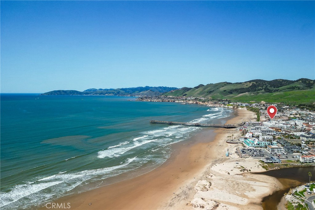 Experience one of the best panoramic ocean and beach views in the area from this stunning third-flood unit and its oversized balcony.
This is a rare opportunity to enjoy maximum personal use and income potential from your investment property. The owner may enjoy up to 90 days per calendar year, with the unit earning rental income the rest of the time. When you're not here, the property is professionally marketed and managed for truly turnkey ownership.
Inside, you'll find:
An elegant fireplace for cozy evenings by the surf.
Granite counters and backsplash in both the kitchen and bathroom.
A fully furnished and ready to enjoy unit.
Current layout with a king bed, with potential to increase occupancy (and income) by reconfiguring sleeping arrangements.
The building consists of just 14 individually owned units, constructed with first class materials and thoughtful design.
From its prime location, walk downstairs to the soft sands of Pismo Beach, take a leisurely stroll on the pier, or explore the many restaurants and boutiques just steps from your door. Watch unforgettable sunsets from your private balcony or listen to the waves while relaxing inside.
Pismo Beach is one of California's premier coastal destinations. Don't miss your chance to own your piece of paradise.
All information is deemed reliable but not guaranteed. Buyer and Buyer's Agent to verify all information and do their own due diligence prior to the close of escrow.