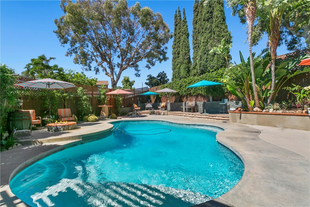 Welcome to 4821 E. Kenyon Place! A rare & charming two-story home nestled in the coveted and sought-after East Orange neighborhood.
This stunning home sits on a premium cul-de-sac lot, almost 10,000 sq. ft! Beautiful residence boasts 1,694 sq. ft, remodeled kitchen,
4 spacious bedrooms (2 upstairs, 2 downstairs) and 2 beautifully remodeled bathrooms, offering modern comfort and style. The resort-style backyard oasis highlights multiple entertainment zones, privacy, and space to grow. Whether you're relaxing by the freshly redone pool, firing up the grill, gardening, entertaining or practicing your swing in the batting cage, this home has it all! Additional features: central air/heat, above ground spa, built in BBQ, patios, screened in porch, newer fuse box, insulated shed with AC (perfect for an office), huge yard, large driveway with possible RV access, mature trees, garage has wall AC and so much more! Don’t miss your chance to own this slice of paradise in Orange!