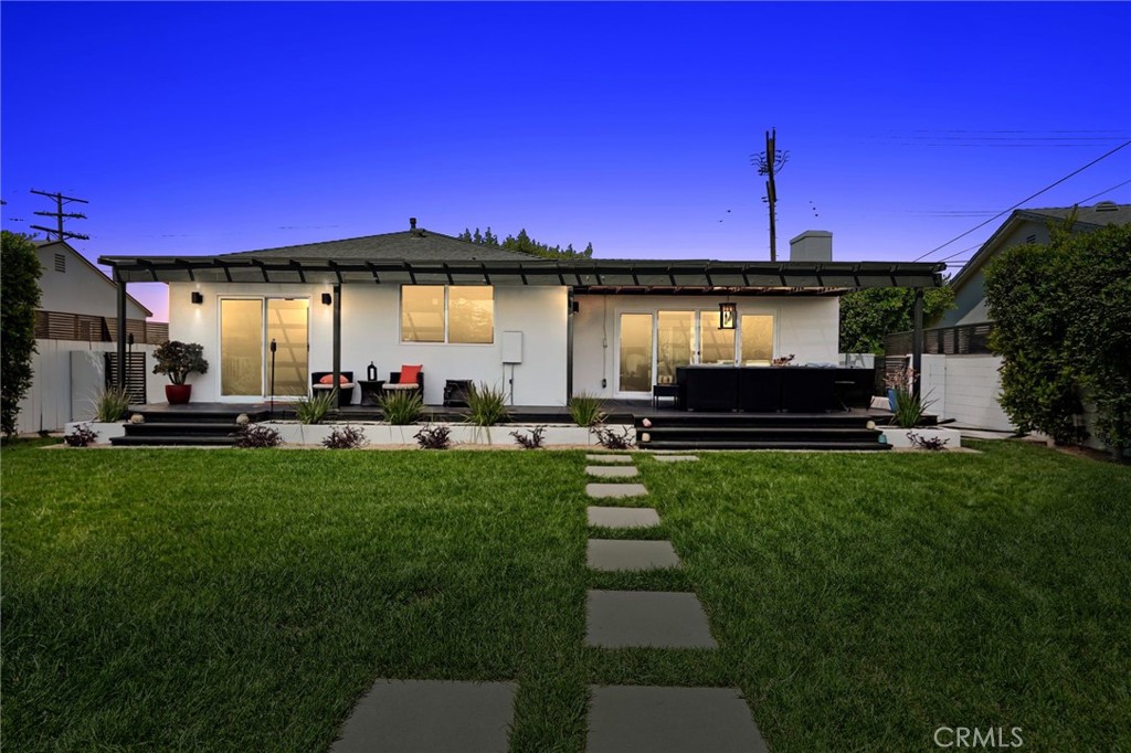Look no further! Turn-Key, Fully Remodeled Home w/ detached garage (great ADU potential- Gas and water piped to the garage and a split AC unit has been installed) in Prime North Hollywood. Enjoy So Cal indoor/outdoor living at it's finest with 1,066 sqft living space on a 6,038 sqft lot. This single family home exudes warmth, character, charm and modern updates, featuring a light and bright open floor plan w/ 3-bedrooms and 2-bathrooms. Entertain in your formal living room or cook a feast in your tasteful custom kitchen with quartz countertops / backsplash and peninsula eat-in bar, complete with stainless steel appliances. Step out through the oversized sliding doors onto your custom deck where you can sit and unwind and enjoy the sunset till the stars come out. Working and playing where you live becomes convenient in the detached garage which can be used as an office space. Other upgrades include, tankless water heater, HVAC system, updated plumbing, electric sub-panel and wiring, recessed lighting, vinyl floors, newer automatic gate w/ alley access and lush new landscaping New water Fountain, rain shower heads with handheld extension in the bathrooms, light fixtures in entryway, backyard, and kitchen Centrally located, close to freeways and shopping centers. Don't miss the opportunity to own this Jem!