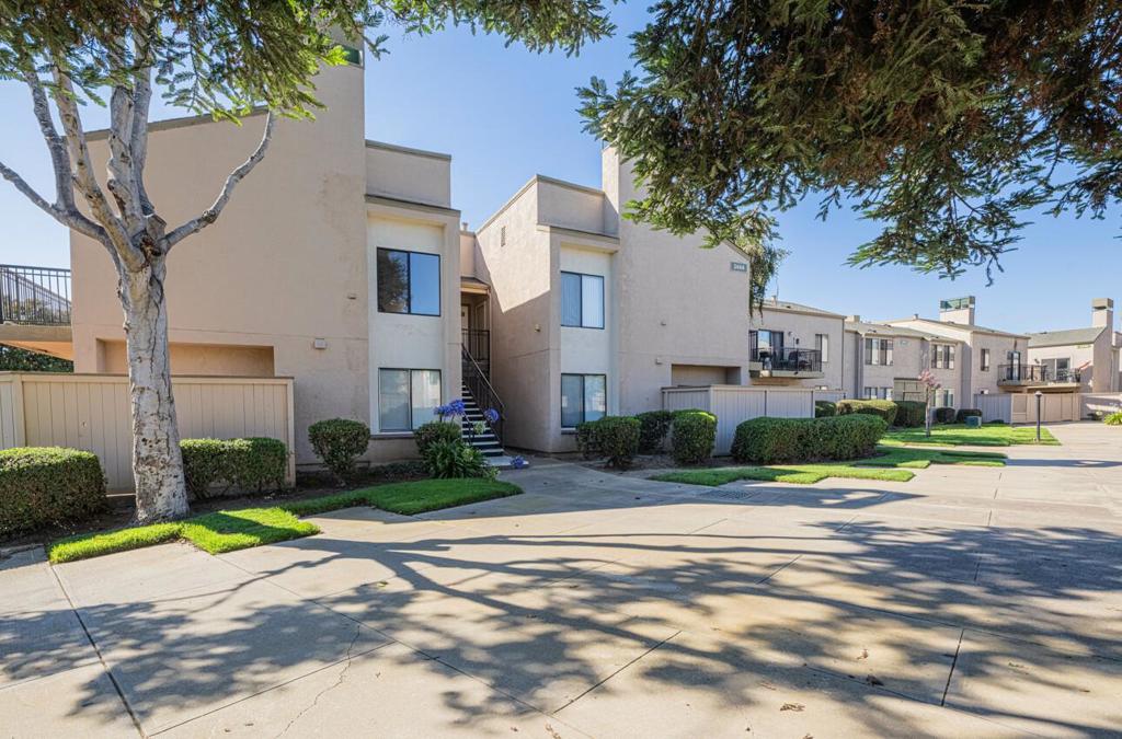 Welcome to North Village Lagoon, where this beautifully updated 1-bed, 1-bath upstairs unit combines comfort and style in a serene community setting. Step inside to vaulted ceilings in both the living room and bedroom, creating an open and airy atmosphere. The home has been tastefully upgraded throughout and is truly turn-key. Recent improvements include premium wood laminate flooring, fresh interior paint, updated baseboards, and all-new interior hardware. The kitchen has been fully remodeled with quartz countertops, subway tile backsplash, new cabinetry, and stainless steel appliances. The bathroom features a new vanity with a quartz countertop, updated fixtures, and refreshed finishes. Recessed lighting, modern light fixtures, and a sleek fireplace surround further enhance the homes appeal. Just steps away, enjoy the community pool and the tranquil water features that flow throughout the grounds. Conveniently located near major shopping centers, dining, and commuter routes, this condo is move-in ready and waiting for its next owner!