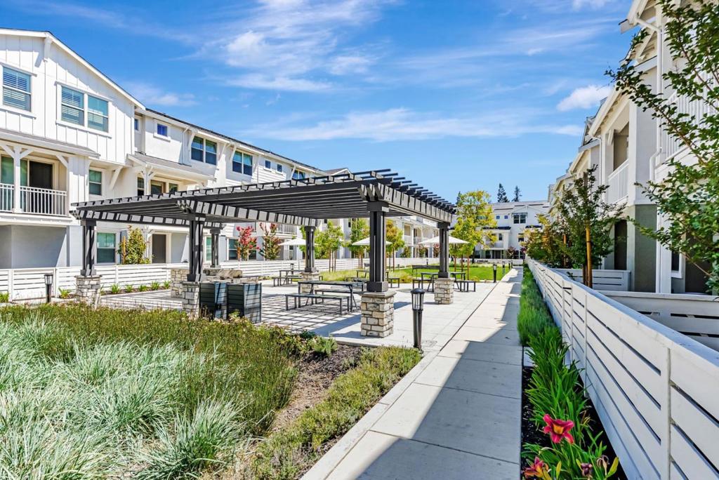 NEW CONSTRUCTION AND MOVE IN READY! Discover modern living in this stunning brand-new corner-unit townhome by award-winning builder SummerHill Homes, located in the vibrant OAK GROVE community of Walnut Creek. This spacious 4-bedroom + office, 3.5-bathroom home offers 2,250 sq ft of open-concept design, perfect for entertaining and everyday living. Thoughtful features include high ceilings, recessed lighting throughout (including all bedrooms), sleek white cabinetry, Bosch appliances, a gourmet kitchen with a large island, and expansive walk-in closets and premium flooring and countertops. OAK GROVE offers incredible amenities including a large community park, two courtyards with outdoor dining and BBQ areas, a dog park, and guest parking. Ideally located just steps from BART, dining, gyms, and trails, with easy access to downtown Walnut Creek, HWY 680 & 24, and excellent schools. Don't miss your chance to own at Oak Grove where location, lifestyle, and luxury meet. Pictures are of actual home with some having been staged.