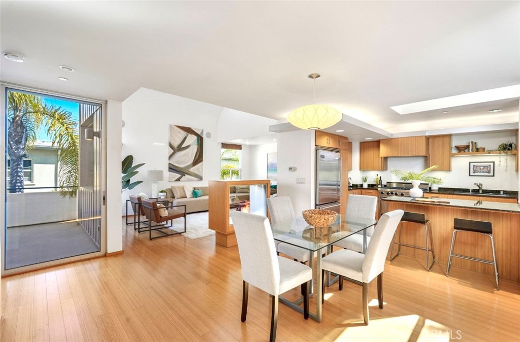 Nestled in the heart of Santa Monica, we welcome you to Santa Monica's First Sustainable Townhome Community. Experience modern eco-conscious living in this tri-level architectural masterpiece designed by award-winning architect Jesse Bornstein. Featured in the LA Times, this exclusive 5-unit townhome complex is ideally situated in the highly sought-after Wilshire Montana neighborhood, just blocks from Erewhon, Whole Foods, Trader Joe’s, Palisades Park, the Santa Monica Stairs, and the iconic Santa Monica Beach. Inside, experience a bright and spacious 2-bedroom plus loft, 2.5-bathroom home offers the perfect blend of luxury, sustainability, and convenience. The entry level features two generously sized bedrooms, each with ensuite bathrooms and custom California Closets. The primary suite opens to a serene private-use patio, ideal for gardening, yoga, or morning coffee. A stackable washer/dryer is conveniently located near the bedrooms. With an abundance of natural light, this level boasts dramatic ceiling heights, a stunning double-sided bio-ethanol fireplace, and an open concept layout perfect for entertaining. Enjoy the gourmet kitchen with Viking appliances, a formal dining area, a powder room, and a veranda for seamless indoor/outdoor living. Ceiling surround sound speakers elevate your movie nights. The loft level is comprised with a versatile space ideal for a home office, fitness studio, or creative retreat. Work your way up to sweeping panoramic views on the rooftop deck, showcasing DTLA’s skyline to the mountains and west to the Pacific Ocean. Additional highlights include a private direct-entry oversized 2-car garage, with Tesla EV charging station, fully paid solar powered system with 10 panels, secure, code-controlled access, and top-rated schools: Franklin Elementary, Lincoln Middle, and Santa Monica High. This one-of-a-kind sustainable townhome offers unparalleled living in one of Santa Monica’s most vibrant and walkable neighborhoods.