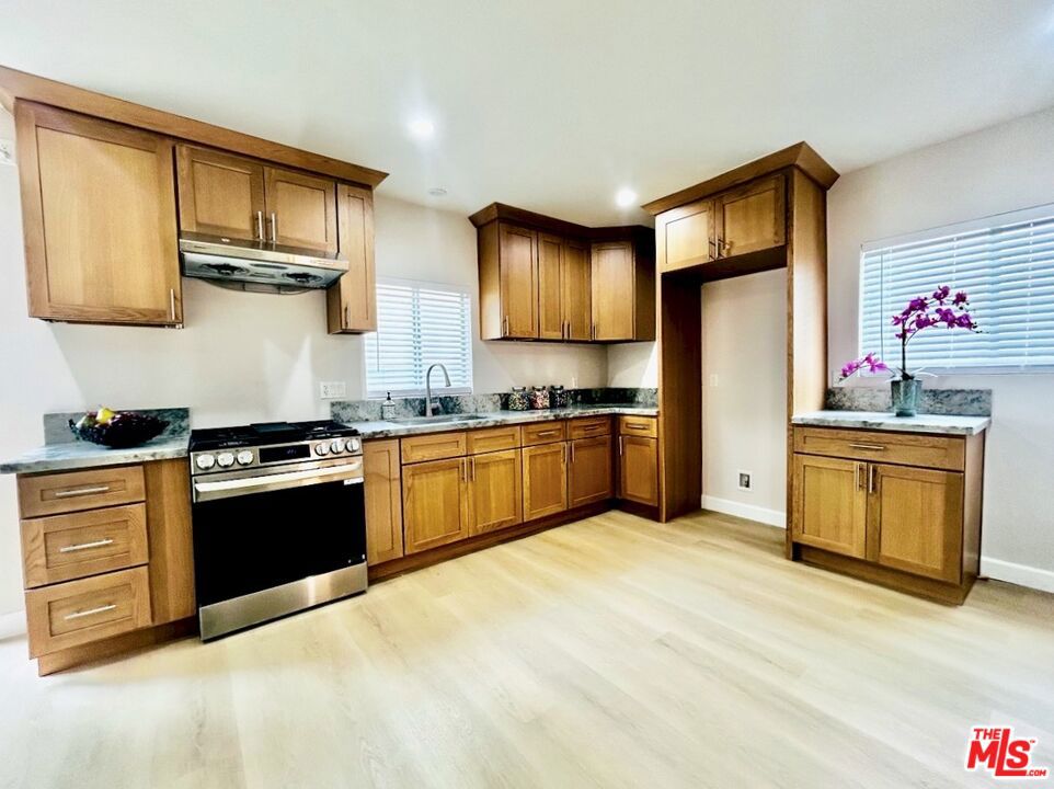 Welcome to this newly updated home in Rosemead! This charming 2-bed, 2-bath attached rear unit features an open concept layout combining living, dining and kitchen areas with vinyl plank flooring throughout. The kitchen is equipped with spacious quartz countertops, a stainless steel sink, and a gas range & hood vent. Soft-close shaker cabinets also offer lots of storage space. Laundry area is conveniently located next to the kitchen and comes with washer and dryer. The primary bath includes a shower over tub and the 2nd bathroom features a tiled shower. Unit entry is located at the rear of the property, accessed through a side yard. Parking available in the shared driveway for 1 car. Tenant pays electricity, gas, and cable/internet/phone. Located near grocery and fast food options such as Costco, Walmart, 99 Ranch, Starbucks & Subway, providing easy access to a variety of goods and essentials. For outdoor activities and relaxation, residents can enjoy nearby parks including Garvey Park, Jay Imperial Park, and the expansive Whittier Narrows Recreation Area.