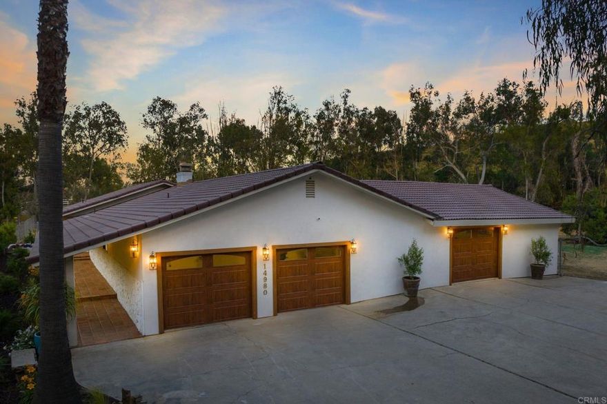 PRICE IMPROVEMENT to $3,150,000 – now better than ever with recent updates!  Don’t miss this incredible opportunity to create your dream coastal estate just minutes from the beach!  Set on a flat and usable 1.37-acre lot within the prestigious Solana Beach School District, this beautifully updated single-level ranch home blends modern design with rustic charm. Wide plank oak floors, custom lighting, new windows, tile, and fresh finishes throughout create a warm, welcoming ambiance that embraces indoor-outdoor living at its finest.  The chef’s kitchen—with an oversized island and open double-sided fireplace—invites both intimate dinners and lively gatherings. The spacious primary suite is a true retreat, featuring dual bathrooms, a private sauna, and a secluded patio.  Additional upgrades include new stucco, new exterior lighting, a new HVAC system, and a fully refreshed landscape and irrigation setup. Outside, the possibilities are endless: envision a pool, vineyard, tennis or pickleball court, stables, or anything else you can imagine.  A standout bonus is the secondary garage, ideal for a workshop, office, artist’s studio, or future ADU (conceptual plans already available).  This is a rare chance to own a versatile, move-in-ready property in a prime location with NO HOA—offering the best of Del Mar and Rancho Santa Fe living. The owner is even open to certain customizations, such as painting or staining the cabinetry.  Endless Possibilities Await!