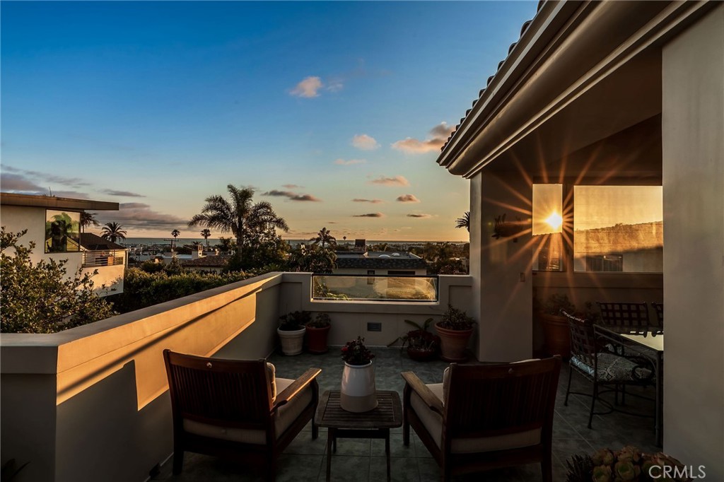 Experience elevated coastal living with panoramic ocean views in this beautifully crafted 3,332 sq ft traditional home, nestled in the highly sought-after Hill Section of Manhattan Beach. Ideally located with just a short stroll to the scenic greenbelt, downtown shops and dining, and the lively Manhattan Beach scene.
Soak in sweeping views from the formal living room, kitchen, family room, and expansive wraparound back deck—perfect for relaxing or entertaining. The chef’s kitchen is equipped with granite countertops, custom cabinetry, two sinks, a commercial-grade range, and French doors that open to a private, wind-sheltered patio ideal for alfresco meals and weekend barbecues. The adjacent family room features a cozy fireplace and custom-built-ins, while a separate formal dining room and a second living room with ocean-view balcony and fireplace add warmth and flexibility. A powder bath and small office complete the upstairs.
Downstairs, the spacious primary suite includes a jetted tub, walk-in shower, dual vanities, and walk-in closet, along with a private office that opens to the backyard for a breath of fresh air while working from home. A second ensuite bedroom, two additional bedrooms with a Jack-and-Jill bath, laundry room with utility sink, and direct-access two-car garage complete the lower level.
Additional highlights include hardwood flooring, dual-pane windows, and thoughtful custom details throughout. Property was designed and equipped to be wheelchair accessible. All just minutes from award-winning schools, boutique shopping, fine dining, and the beach—with easy access to LAX. *Some photos have been virtually staged.*