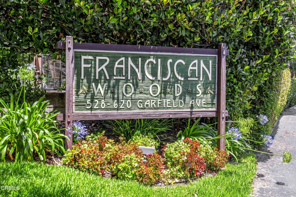 Welcome to this exceptional townhome located in the serene and highly desirable Franciscan Woods community of South Pasadena. Hidden away in a peaceful setting surrounded by mature trees and meandering pathways, this residence offers a rare sense of privacy--yet is just blocks from the vibrant shops, cafes, and restaurants that define the charm of South Pasadena. As you approach the residence, you are welcomed by a spacious, gated front patio--perfect for entertaining, outdoor dining, or simply enjoying your morning coffee in a tranquil environment. Inside, the open split-level floor plan features a generous living room with a decorative fireplace and a sliding glass door that provides a seamless indoor-outdoor flow to the front patio. This inviting space offers multiple layout possibilities, making it ideal for both relaxing and entertaining. The sophisticated dining room overlooks the living area and leads into a well-appointed kitchen complete with granite countertops, stainless steel-style appliances, abundant cabinetry, a built-in pantry, and a buffet area--ideal for coffee stations or additional prep space. The main level also includes a convenient laundry area and a stylish powder bath. Upstairs, you will find two expansive en-suite bedrooms, each offering unique appeal and privacy. The primary suite is a true retreat, featuring a spacious lounge area, walk-in closet, and a luxurious remodeled bathroom with a jetted soaking tub, frameless glass-enclosed shower, dual-sink vanity with quartz-style countertops, plus a dressing area with additional closet space. The secondary suite impresses with soaring vaulted ceilings, a massive walk-in closet, and an updated full bathroom--perfect for guests, home office or shared living. Additional features include fresh interior paint, bamboo-style flooring throughout, central air and heat, and a direct-access two-car garage with additional storage and battery back-up opener with wifi capability. Situated in the sought after Marengo neighborhood within the award-winning South Pasadena School District, and just minutes from Garfield Park, the San Marino Mission District, and major commuter routes. Don't miss this rare opportunity to enjoy spacious, refined living with unbeatable access to top-rated schools, vibrant city life, and peaceful surroundings--all in one of the most coveted communities in South Pasadena. Welcome home!