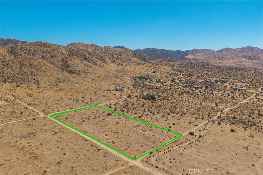 Incredible opportunity to own 5 scenic acres in the highly sought-after Upper Sky Harbor neighborhood of Yucca Valley. This prime parcel is surrounded by custom homes on large lots and offers panoramic views of the surrounding desert and mountains. Located within walking distance to Black Rock Canyon, one of the most beautiful entrances to Joshua Tree National Park, this property combines privacy with direct access to nature.
The land includes native desert plants, including Joshua Trees, cholla, creosote, and other beautiful high desert vegetation, creating a serene and authentic Mojave landscape. Properties in this area rarely come on the market, making this a unique chance to secure land in one of Yucca Valley's most desirable neighborhoods. Utilities appear to be nearby (buyer to verify). Drive by to truly experience the setting, the views, and the peaceful surroundings. A perfect spot for your dream home.