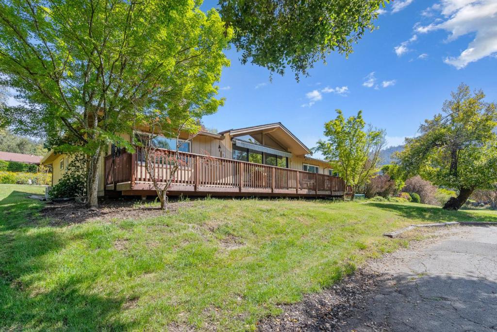 VERY LOW INTEREST RATE SELLER FINANCING POSSIBLE!!! Light, Bright, and Absolutely Stunning Villa with Breathtaking Views! Wake up every day to views of the pond right from your expansive 45' x 8' deck complete with both a fixed and automatic awning for sunny days.This beautifully upgraded home is bathed in natural light and showcases nature from every window. Step inside to find gorgeous hickory Aqua Dura engineered floors, open-beam ceilings, and a seamless flow from the welcoming living room to a cozy separate family room with built-in storage and playful tile accents. The updated kitchen is a chef's delight with sleek quartz countertops, upgraded appliances, reverse osmosis water system, and a high-efficiency induction cooktop. This home offers 3 spacious bedrooms and two beautifully custom-designed bathrooms. Major upgrades include updated plumbing and electrical systems, three energy-efficient mini-split units for personalized heating and cooling, and a house generator for peace of mind. Additional features include an attached garage, with laundry, and plenty of storage. All this nestled among the redwoods in a peaceful Boulder Creek setting where you will enjoy tranquil walks, disc golf, and traditional golf just across the way. This is more than a home; its a lifestyle