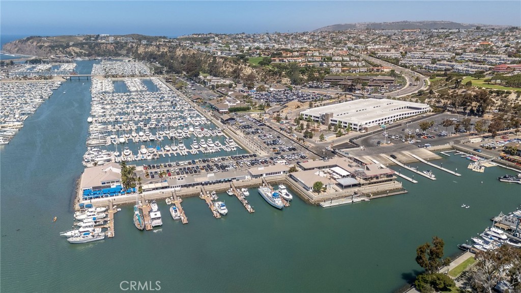 Coastal Living Redefined in Dana Point’s Harbor Creek Community || Nestled in the heart of Dana Point, this beautifully renovated Harbor Creek condo blends modern living with coastal charm. With exclusive trail access to Doheny State Beach, this hidden gem invites you to experience the ultimate Southern California lifestyle. Whether you’re drawn to serene beach days or exploring the vibrant local community, this move-in-ready home is your gateway to it all. || Step inside to find a modern kitchen with white cabinetry, quartz countertops, and a custom backsplash, complemented by sleek tile flooring throughout. The spa-like bathroom features a newly renovated shower, and thoughtful updates include luxury vinyl flooring, recessed lighting, and a stylish ensuite vanity. Vaulted ceilings in the living room enhance the sense of space, a valuable feature at this price point. ||
Your coastal retreat also includes an assigned covered carport and plenty of guest parking for convenience. Best of all, you’re less than a mile from surf and sand via a private walking and biking path—with no streets to cross. || Dana Point Revitalization Plans || Dana Point is on the cusp of exciting transformations, making this an ideal time to invest. The ongoing harbor revitalization project promises a world-class waterfront destination with upgraded facilities, expanded dining, and a vibrant marina. The Lantern District flourishes with trendy shops and nightlife, while historic Los Rios District in nearby San Juan Capistrano is undergoing its own renaissance. || Active Coastal Lifestyle || Living in Dana Point means enjoying a dynamic lifestyle. Walk to the harbor for whale-watching tours, set sail, or tackle the waves with surfing and paddleboarding. The community comes alive with summer concerts, festivals, and a diverse dining scene. Trails for hiking and biking are nearby, and the 5 Freeway offers easy access to explore all Orange County has to offer. || This Harbor Creek condo is more than a home; it’s your chance to immerse yourself in the unparalleled beauty and energy of Dana Point. Don’t miss this opportunity to own your slice of paradise in a city shaping the future of coastal living. Schedule your private viewing today!