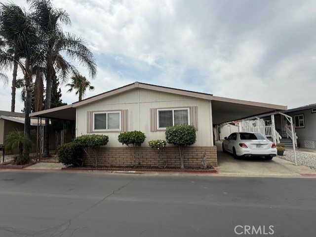 Prime Location in the Desirable 55+ Rancho Ontario Community!
This spacious 3-bedroom, and 2 full baths manufactured home offers 1,536 sq feet of comfortable living space in one of the park’s largest spaces and most convenient locations—right next to visitor parking.
Enjoy a perfect floorplan with the primary suite privately situated on one side and two additional bedrooms on the other side of the home. The home features an inviting open layout with a cozy fireplace and updated kitchen appliances that go with the sale. The roof has been updated, updated flooring, and updated ramp, and deck.
The covered carport accommodates up to four vehicles, offering both convenience and ample parking space.
Rancho Ontario Park boasts fantastic amenities, including two dog parks, bocce ball courts, and pickleball courts—perfect for active and social living.
Don’t miss this opportunity to live in a well-maintained, amenity-rich community