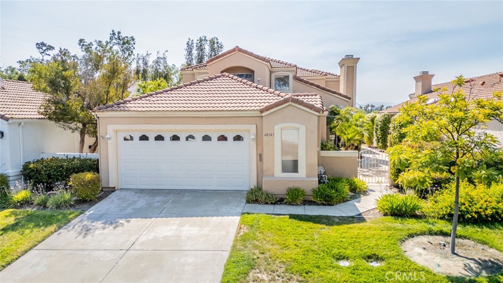 Live the LIFESTYLE You've Dreamed Of! Welcome to this exceptional 55+ home in the highly desired, guard gated, COLONY community in Murrieta, where resort style living meets everyday comfort. From the moment you enter through the secure gates you'll be surrounded by beautifully manicured grounds, tree lined streets, and a sense of peace and privacy. This thoughtfully designed residence offers a bright open floor plan perfect for both relaxing and entertaining. The NEWLY painted interior features a spacious living area with cozy fireplace which opens to your large formal dining space, and well appointed kitchen with NEW appliances, ideal for hosting friends or enjoying quiet mornings. Generous windows fill the home with natural light while framing serene views of the lush surrounding landscape. Downstairs you will also find the first of TWO primary suites. This downstairs suite features large adjoining bathroom as well as slider to your outdoor space. An additional guest bathroom and laundry room can be found downstairs for added comfort and convenience. Head upstairs to find a secondary primary bedroom with an even larger ensuite bathroom and balcony to take in the sweeping views around you along with a third guest bedroom- all with NEW carpet! Stepping outside you will find a perfectly sized, low maintenance, outdoor space with large private courtyard entrance, covered back patio and beautiful VIEWS. Beyond your doorstep an active lifestyle awaits. Enjoy golf, a stunning clubhouse, sparkling pool, tennis courts, walking trails, and more, along with a full calendar of social events. There's something for everyone in this community where everyday feels like a vacation! Schedule your private showing today!