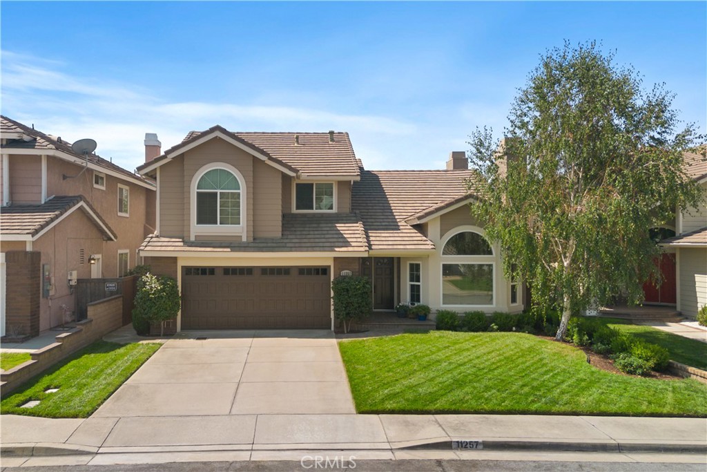 Welcome to 11257 Bethany Drive, Rancho Cucamonga. This beautiful home has been cherished by the same family since it was brand new and is now ready for the next family to create their own special memories. From the moment you drive up, it's evident that this home has been loved and well cared for. With stunning curb appeal, a welcoming pristine yard and a fresh coat of paint, this home will impress anyone who passes by. As you walk through the double door entry, you will immediately feel at home. An abundance of natural light streams through the upgraded windows and the vaulted ceilings give the space an airy open feel. The living and dining room combine to create the perfect area for entertaining family and friends. The open floor plan includes a family room with a cozy fireplace, which flows seamlessly into the kitchen and dinette area. You will love the elegant yet functional upgrades in the kitchen. A wall of windows in the kitchen/dinette overlooks the tranquil beauty of the lush backyard which feels like a private oasis. It features beautiful landscaping and a covered patio that offers a peaceful getaway. You will find yourself wanting to enjoy your morning coffee surrounded by this serene setting. This floor plan offers the highly coveted downstairs 4th bedroom, ideal for guests or perfect for those who work remotely and need a home office. If you have a family member who has difficulties navigating stairs, this downstairs bedroom is near a full bathroom, and provide the perfect accommodations. Upstairs, you will discover three generously sized bedrooms. The primary bedroom is spacious and features vaulted ceilings. The sellers have recently remodeled the primary bathroom with stylish new cabinetry, countertops, and a stunning step-in shower—it is absolutely gorgeous! The walk-in closet provides ample space for your wardrobe. The whole house fan and upgraded Milgard Windows throughout the home, will help you keep your utility costs down. For those with electric vehicles, the garage includes two separate electric circuits inside and one outside to conveniently charge your cars. This home is situated in a highly sought-after neighborhood of Rancho Cucamonga, conveniently located near award-winning schools, easy freeway access, Central Park, and is just a short distance from Victoria Gardens. Given the current cost of construction, finding a move-in ready home like this one makes perfect sense. Don't miss your chance to make this amazing home your own!