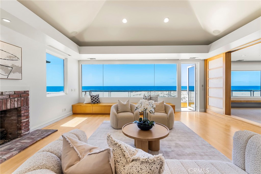 Experience the epitome of luxury beachfront living at 1554 E Oceanfront in Newport Beach, California. This stunning residence, located in the prestigious Balboa Peninsula Point offers a captivating blend of elegance and modern amenities. Boasting five spacious bedrooms and a five-car subterranean garage, this home promises ample space and convenience for both residents and guests. Step in to where the kitchen and living room seamlessly merge to create a harmonious space designed for comfort and elegance. The gourmet kitchen features top-of-the-line appliances, sleek countertops, and ample storage, making it a chef's delight and perfect for both intimate meals and grand entertaining. The adjoining living room is a sanctuary of relaxation, with its open-plan design providing a seamless flow from one area to the next. Expansive sliding glass doors open onto a stunning patio, blurring the lines between indoor and outdoor living and offering uninterrupted views of the majestic ocean. This exquisite setting is perfect for enjoying the tranquility of seaside breezes and breathtaking sunsets, creating a perfect backdrop for both everyday living and memorable Situated on 40 feet of Oceanfront frontage, the residence offers direct access to the beach, making it an ideal retreat for those who cherish the sound of waves and the feel of sand underfoot. The surrounding area is celebrated for its coastal charm and proximity to various amenities, ensuring a lifestyle of comfort and leisure. This exceptional oceanfront home is not just a residence; it's a gateway to a luxurious beachside lifestyle.