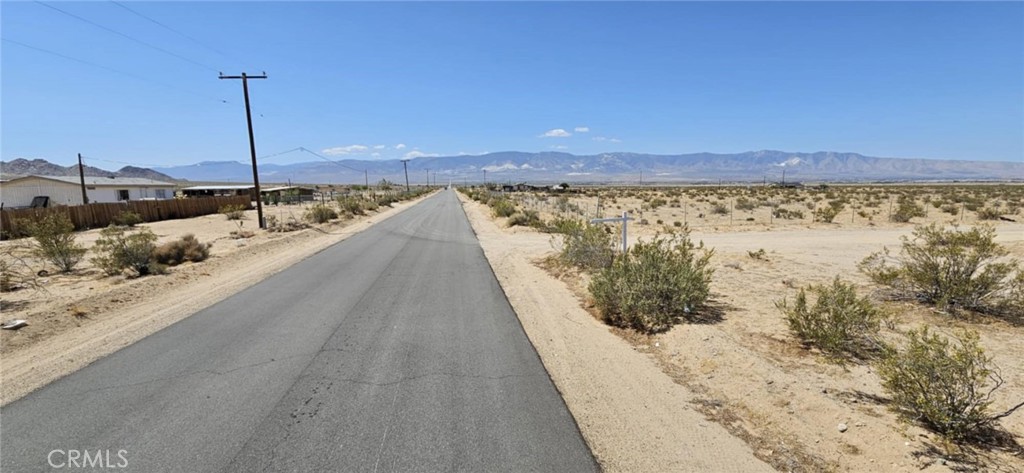 Don't miss this rare opportunity to own 5 acres of flat, buildable land in a peaceful area of Lucerne Valley—with power access and paved road frontage on Harrod Rd! Build, camp, or invest in this parcel and enjoy wide open views, beautiful sunsets, and easy access to town. Opportunities like this don’t come around often, drive by and check it out before someone else does! APN: 0452-151-52-0000. Latitude:34.511278, Longitude:-116.858898.