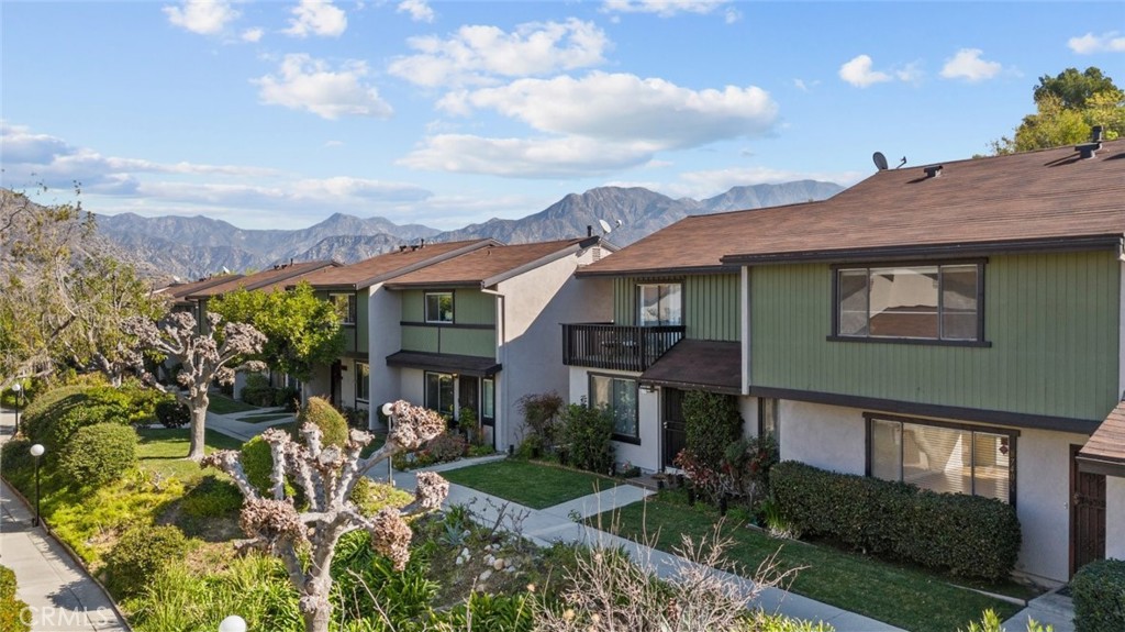 Discover this inviting 3-bedroom, 2-bathroom townhome located in Sunland, adjacent to Shadow Hills, offering 1,218 square feet of well-designed living space. This charming residence is part of a sought-after gated community that provides a wealth of amenities, including a pool, spa/hot tub, tennis court, basketball court, clubhouse, and multiple small parks for relaxation and recreation. The home welcomes you into a bright and open living area featuring stylish flooring and large windows that fill the space with natural light. The kitchen offers a functional layout with modern appliances, ample cabinetry, and a convenient dining space. The living area seamlessly connects to a private outdoor space, perfect for enjoying the California weather. Upstairs, the three bedrooms provide comfortable retreats, each with generous closet space and tranquil views. The bathrooms are well-appointed with classic finishes, ensuring both style and convenience. A standout feature of this home is its detached garage, offering secure parking and additional storage. With access to resort-like amenities and a prime location near shopping, dining, and outdoor recreation, this townhome is an exceptional opportunity in Sunland.