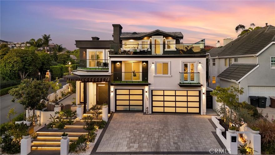 Welcome to 35242 Vista de Todo — an extraordinary, completely rebuilt coastal residence situated on a private cul-de-sac of just ten homes in coveted Capistrano Beach. Blending refined craftsmanship with modern sophistication, this home showcases custom teak wood flooring, designer finishes, and an open-concept layout ideal for entertaining. A dramatic 5-foot-wide by 8-foot metal pivot front door sets the tone for the impressive interior, leading to a formal dining room and a spacious family room with a custom fireplace. The gourmet kitchen is a chef’s dream, featuring marble countertops, Thermador stainless steel appliances, and a wine refrigerator. The main level offers two bedrooms, including a guest suite with an ensuite bathroom and walk-in shower, along with a full guest bath, powder room, laundry room, and direct access to the three-car garage. The backyard is designed for both relaxation and recreation, complete with a putting green and outdoor fireplace. Upstairs, two additional bedroom suites each offer spa-inspired bathrooms and walk-in closets, complemented by a loft, full bath, and a second laundry room. The third level is devoted to the luxurious primary suite, featuring a walk-in closet, office nook, and a private deck where you can unwind while taking in sweeping ocean and sunset views. In addition, the home includes approximately 1,000 square feet of attic storage, a 400-amp electrical panel, and EV charging capability in the three-car garage. Just minutes from Dana Point Harbor and the San Clemente Pier, this stunning home offers the perfect blend of coastal serenity and contemporary elegance — a true embodiment of Southern California living at its finest.