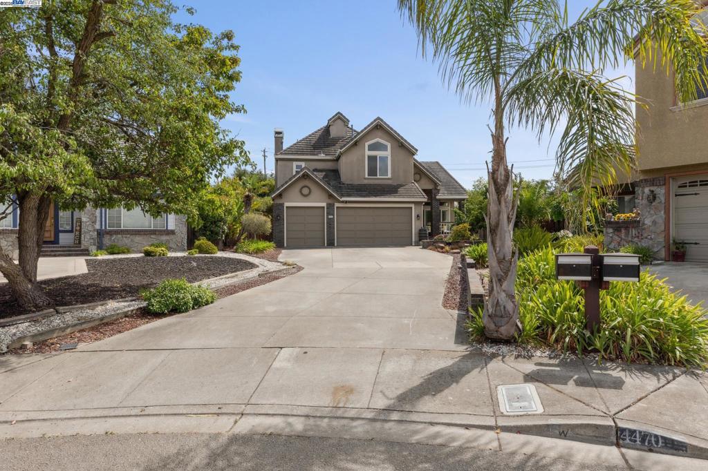 Located in a quiet cul-de-sac in the sought-after Prominence neighborhood of Hayward Hills, this stunning 4-bed, 3-bath home offers 3,045 sq ft of well-designed living space on a massive .37 Acre usable lot. The main level features a bed and full bath,plus a formal living room with soaring vaulted ceilings, a spacious dining room, and a large kitchen with stone countertops, a center island, gas cooktop, and wine fridge. The kitchen opens to a generous family room with an updated fireplace, and sliding doors leading to the beautifully landscaped backyard. Upstairs, the expansive primary suite overlooks the lush yard and includes a cozy fireplace, spa-like bath with jetted tub, dual vanities, and a large walk-in closet. Two additional bedrooms with high ceilings and a full bath complete the upper level.Enjoy the convenience of a main-level laundry room, a 3-car side-by-side garage, and a long driveway with room for multiple cars. Energy-efficient paid-off solar panels. The backyard is a true highlight; thoughtfully landscaped with multiple entertaining zones, a fire pit, greenhouse, and an incredible variety of mature fruit trees: plum, apple, lemon, almond, grapefruit, cherry, grape, pear, apricot, fig, pomegranate, lime, and orange.