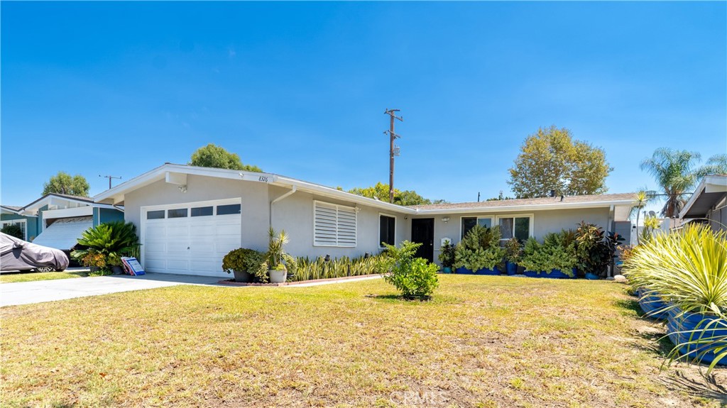 Fresh, light-filled, and fully renovated with permits, this 4-bedroom, 2-bath home offers 1,269 sq. ft. of comfortable living space in a desirable residential neighborhood. The open-concept layout features a spacious living room, modern kitchen with brand-new appliances, custom cabinetry, and stylish tile work. Recent upgrades include: central A/C, new electrical panel, tankless water heater, dual-pane windows, new flooring, modern lighting, and fresh interior/exterior paint. The finished backyard is perfect for entertaining, with pavers, low-maintenance artificial turf, and a high-end covered patio. Additional highlights include an indoor laundry room and a 2-car garage. Located just 0.5 miles from the 605 Freeway, with nearby schools, parks, shopping, and dining.