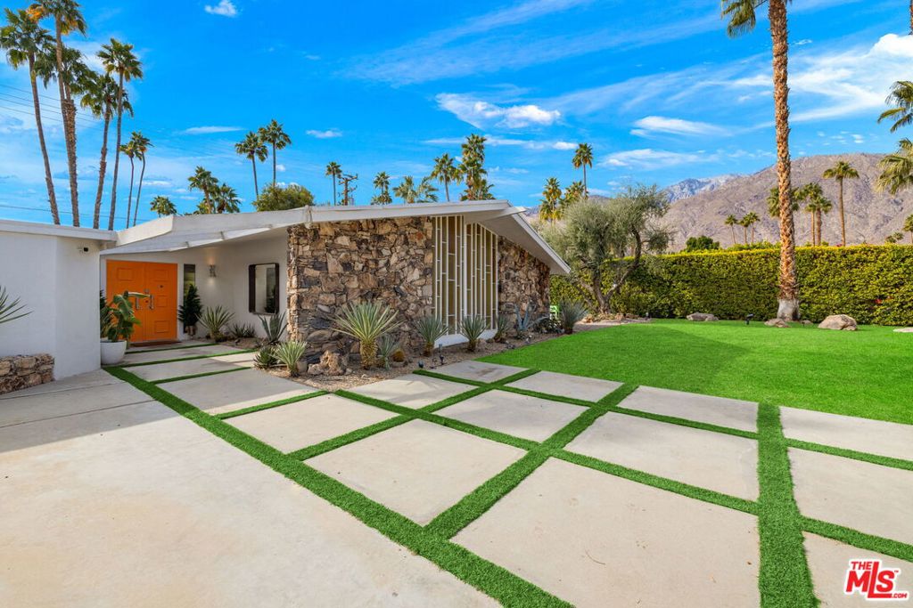 **Available: SEPT $9,500 | OCT-NOV $11,500 | DEC $14,000 | JAN $16,500 | UNAVAILABLE FEB +. MARCH 2026. 1-Year Lease: $13,000/month **Welcome to The Mesquite Retreat** a fully furnished Mid-Century gem in the highly sought-after Deepwell neighborhood of South Palm Springs. Hidden behind a private concrete block wall, this architectural home invites you in with its striking floor-to-ceiling stained glass window and iconic 1960s style. The expansive living area features vaulted ceilings, polished concrete floors, and a dramatic rock wall fireplace perfect for entertaining. The open-concept kitchen is outfitted with Viking appliances and bar seating that draws guests in naturally. Two sets of sliders lead to the recently remodeled pool reminiscent of a boutique hotel and completely Instagram-ready framed by olive and palm trees with sweeping mountain views. The principal suite offers resort-level comfort with double door entry, oversized soaking tub, a large walk-in shower, and direct access to the pool. Two guest bedrooms open to a private second backyard featuring a spa, BBQ, and lounge area. Inside, the step-down media room includes a projector screen, oversized sectional, and built-in office space. This is the ultimate desert escape, just moments from Palm Springs' best dining, shopping, and nightlife, and only a short bike ride to Downtown Palm Springs!