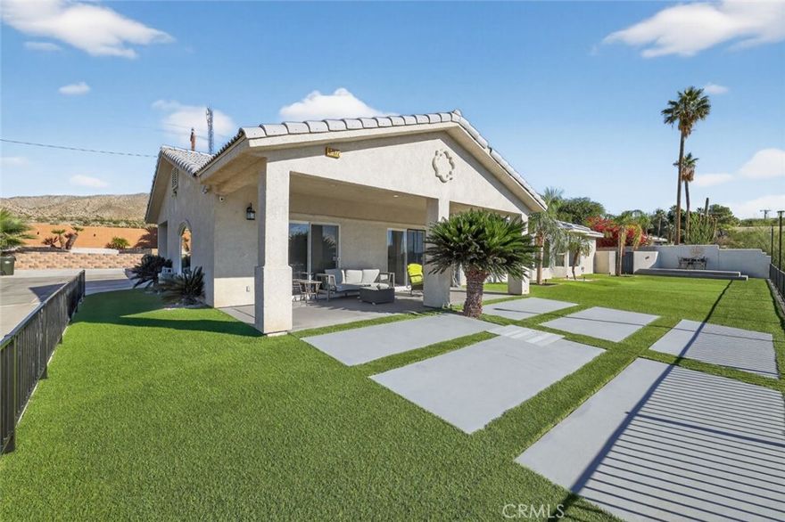 Turnkey desert oasis with resort-style backyard, pool, and solar.

Welcome to 67972 Monterico Road, a beautifully maintained and thoughtfully upgraded single-family home offering the perfect blend of comfort, style, and outdoor living. This 2,344 sq ft residence features 3 bedrooms, 2.5 bathrooms, and a 3-car attached garage, all set on a spacious lot designed for entertaining and relaxation.

The backyard is truly the star of the home, featuring a newly built pool and spa, expansive concrete paver walkways with turf inlays, and redesigned, low-maintenance landscaping, along with multiple covered patio areas and pergolas that create ideal spaces for lounging, dining, and hosting gatherings year-round, all framed by mountain views and mature palm trees for a true resort-style feel.

Inside, the home offers a bright and open layout with high ceilings, recessed lighting, and abundant natural light, while the kitchen is both functional and inviting with granite countertops, ample cabinetry, stainless steel appliances, and a large island perfect for casual dining or entertaining. Living areas flow seamlessly to the outdoor spaces, enhancing the indoor-outdoor lifestyle.

The home is being offered fully furnished, making it move-in ready for a primary residence, vacation home, or investment opportunity, and leased solar panels add energy efficiency and help offset utility costs. Located in a desirable Desert Hot Springs neighborhood just minutes from Palm Springs, shopping, dining, and outdoor recreation, this property offers the best of desert living with modern convenience and is a rare opportunity to own a turnkey home with exceptional outdoor amenities.