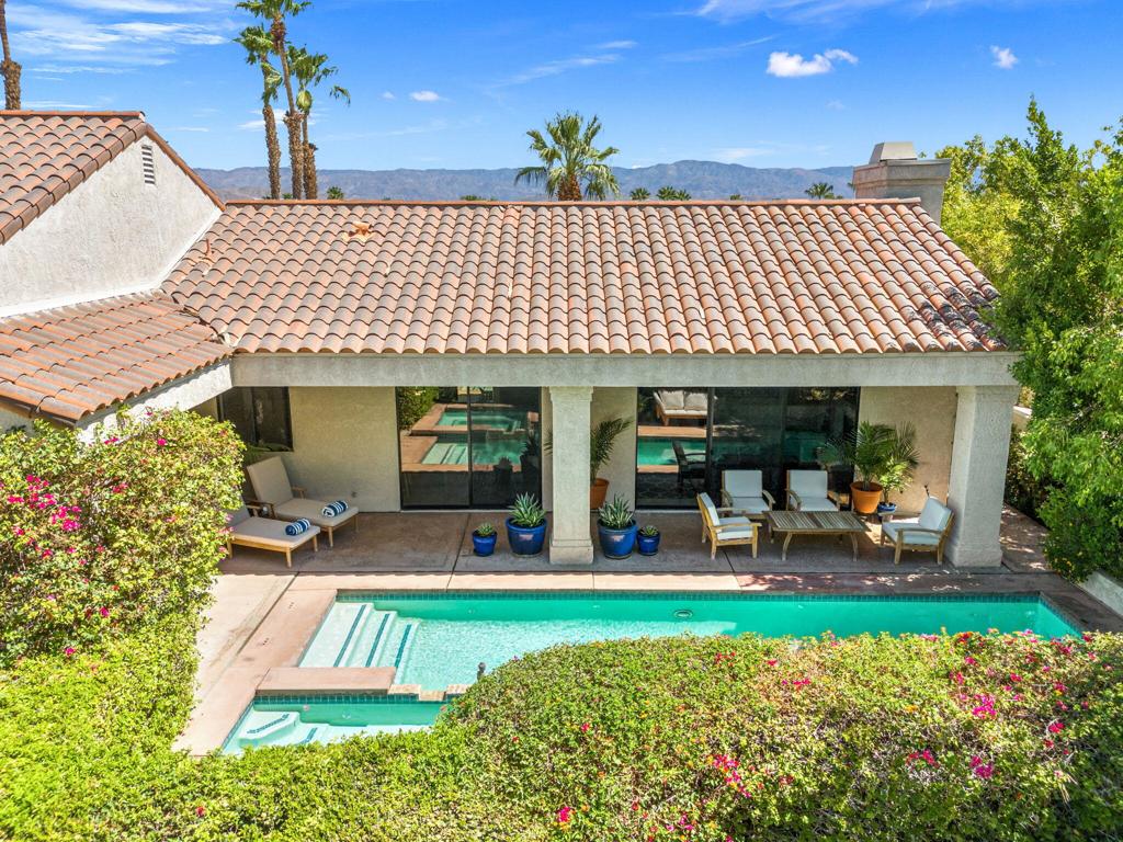 Located in a prime central spot within Mission Hills Country Club, this beautifully maintained southwest facing pool home offers the perfect blend of comfort, privacy, and resort-style living. With 3 bedrooms, 3 bathrooms, and 2,454 square feet of living space, the home features an open layout ideal for both relaxing and entertaining. Enjoy sun and mountain views from your private pool and spa, surrounded by lush, mature landscaping that creates a peaceful, desert retreat. The spacious 2-car garage plus dedicated golf cart space adds convenience for full-time or seasonal living. As a member of Mission Hills, you'll enjoy access to 54 holes of championship golf, a world-class tennis and pickle ball center with hard, clay, and grass courts, a full fitness facility, spa and salon, and a vibrant social and dining scene at the clubhouse. HOA fees include front yard maintenance, gated security, cable TV and internet, community pool access, and more. This home offers a rare opportunity to live in one of Rancho Mirage's most sought-after communities, combining elegance, amenities, and a central location that puts everything the desert has to offer within easy reach.