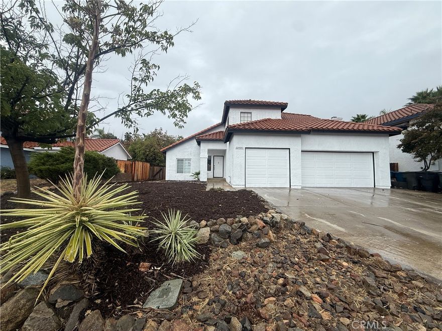 Beautifully Renovated 5-Bedroom Home on a Quiet Cul-de-Sac in Wildomar

Welcome to 22900 Kuna Court — a spacious and tastefully updated 5-bedroom, 3-bathroom home located on a peaceful cul-de-sac in a desirable Wildomar neighborhood.

This home has been recently renovated and features fresh interior and exterior paint, desert landscaping with California native plants and mulch, reglazed kitchen countertops, reglazed walk-in shower, and serviced A/C, ensuring comfort and style throughout.

Step inside to a lovely entryway that opens to a bright living and dining room combo, perfect for entertaining. The family room features a cozy fireplace and flows seamlessly into the kitchen, which offers a breakfast nook, newer-style cabinets, countertops, and modern appliances.

A convenient downstairs bedroom and full bathroom provide flexibility for guests or multi-generational living. Upstairs, you’ll find the spacious master suite with an attached bathroom featuring dual sinks, a separate soaking tub, and a shower enclosure, along with the remaining bedrooms that offer plenty of space for family or a home office.

Enjoy outdoor living in the large backyard with covered patio areas, ideal for relaxing, dining, or entertaining. The home also includes an attached three-car garage with driveway, providing ample parking and storage space.

Located close to schools, parks, shopping, and freeway access, this beautifully refreshed home offers comfort, convenience, and charm — ready for you to move right in. Don’t miss your chance to make 22900 Kuna Ct your new Wildomar home!