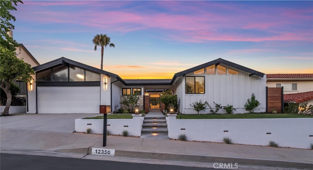 Welcome to this gorgeous fully renovated mid century modern masterpiece with incredible panoramic views. From the moment you arrive, you'll be captivated by the sleek curb appeal, curated landscaping, and undeniable pride of ownership. Situated in the highly coveted Knollwood Country Club Estates this residence sits elevated high above the golf course on a nearly 12,000 sq ft expansive lot. Walk in through the beautiful courtyard, through the stunning modern iron glass doors and enjoy the views through the wall of glass. This home features 3 bedrooms, 3 baths, formal living and dining rooms, den and nearly 2300 sq ft of open living space. Experience new high end wide plank flooring in Shell Beach throughout, new Anderson windows and doors, designer light fixtures, new inviting paint selections, custom built-ins, and new interior doors with modern hardware. The floor to ceiling rock fireplace is the showcase of the home and enhances the organic esthetic vibe of the space. The kitchen is a chef's dream with leathered quartz in Taj Mahal, white oak modern cabinetry with custom spice racks and appliance storage, custom hood, stainless luxury Zline appliances, microwave drawer, dry bar with wine refrigerator and a huge 10 ft island with seating for five. The primary suite is on it's own private wing and boasts tons of closet space, luxurious bath, access to two private patios and views of the courtyard and fountain. The ensuite bath includes a double walk in stone tiled shower and a modern white oak double vanity with Calacata Amani quartz. The secondary bedrooms are ample in size and both have ample closet space. The hall bath features an oversized vanity with two sinks and beautiful Linen Limestone Star Crossed honed mosaic tile. Other modern conveniences include recessed lighting, indoor laundry room, 2 car garage and your very own mud room with custom doggie wash station! Walk outside to your own private oasis with a brand new pool, spa, multiple lounge spaces, large side yard for play and incredible VIEWS of the Knollwood Golf Course and the surrounding landscape. Close to shopping, award winning schools and easy access to the freeways.