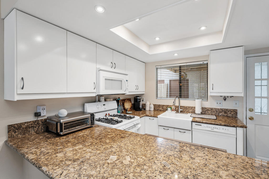 This three-bedroom, two-bathroom condominium/townhome offers approximately 1,218 square feet of well-designed living space. The property features well-maintained landscaping, providing a visually appealing exterior. The secure entryway ensures a safe and controlled access point to the home.The open concept layout creates a seamless and spacious flow throughout the living areas. The generous square footage allows for a comfortable and versatile arrangement of furniture and decor. Abundant countertop space in the kitchen provides ample room for meal preparation, while the plentiful cabinetry offers extensive storage options.The spacious bathrooms offer a serene and relaxing atmosphere, with features that cater to personal hygiene and grooming needs. Additional storage space is available throughout the home, allowing for efficient organization and clutter-free living.The neutral color palette provides a neutral background that can be easily personalized to suit individual preferences and design styles. The covered patio offers a pleasant outdoor space for leisure or entertaining, extending the living area and providing a connection to the surrounding environment.