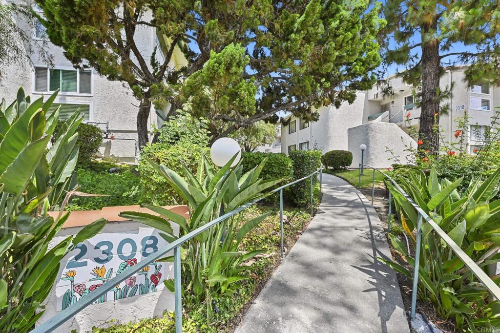 Welcome to La Costa Views, where modern updates meet a prime Carlsbad location. This beautifully refreshed 2-bedroom, 2-bathroom condo offers comfort, convenience, and community amenities just minutes from shopping, dining, golf, and the coast. Inside, you’ll find a bright and open floor plan featuring new luxury vinyl plank flooring, fresh neutral paint, and large sliding glass doors that fill the home with natural light. The spacious living room includes a wet bar with mirrored shelving, perfect for entertaining. Step outside to your private covered balcony surrounded by mature landscaping, creating a peaceful retreat. The updated kitchen boasts white cabinetry, sleek countertops, stainless steel appliances, and a cozy dining nook with modern lighting. Both bedrooms are generously sized, including the primary suite with mirrored closet doors, a walk-in closet, and direct patio access. Bathrooms have been tastefully remodeled with quartz-topped vanities, updated fixtures, and a subway-tile shower/tub combo with glass enclosure. Enjoy a second private outdoor space off the primary bedroom, featuring lattice screens for extra privacy. The community offers a sparkling pool, spa, and sun deck with hillside views—perfect for relaxing year-round. Conveniently located in the heart of La Costa, this home places you near La Costa Resort, Bressi Ranch, top-rated schools, golf courses, and world-class beaches. Whether you’re seeking a primary residence, vacation retreat, or investment property, this condo delivers the ideal blend of lifestyle and value.