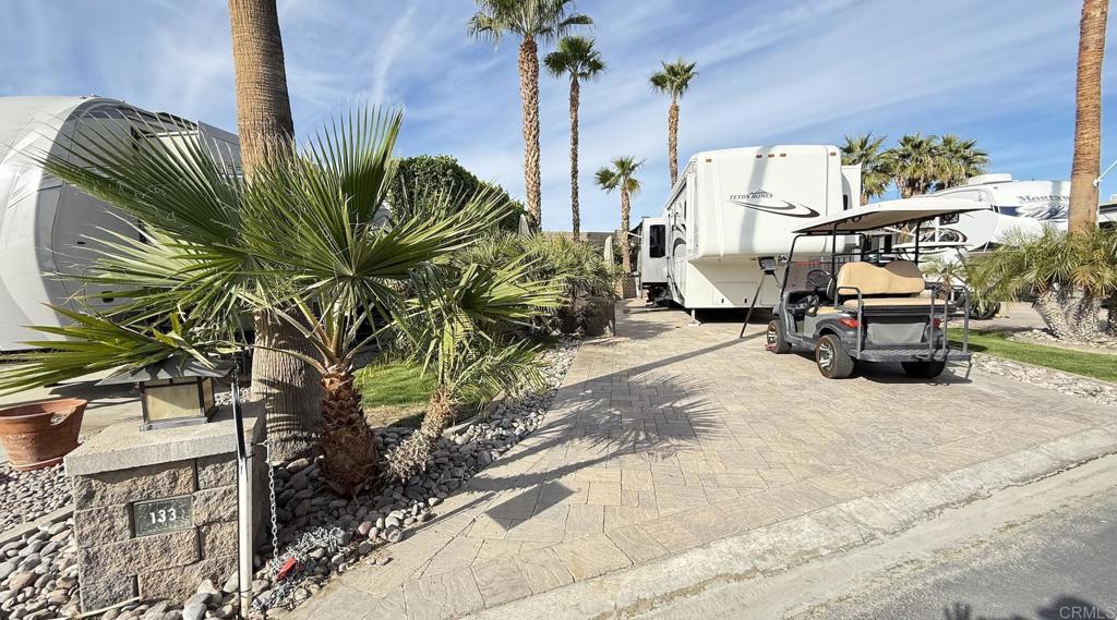 Lot 133, West wall privacy across from front 18 golf course with lush landscaping. Tall hedges provide afternoon shade. Beautifully paved! Outdoor Resort Palm Springs (ORPS) is a Guard Gated 5-Star RV Resort Community offering an active and luxurious lifestyle featuring golf (27 holes), tennis, pickleball, swimming and more! Two clubhouses, fitness center, beauty solan, La Roma Restaurant on campus, dog park and more!